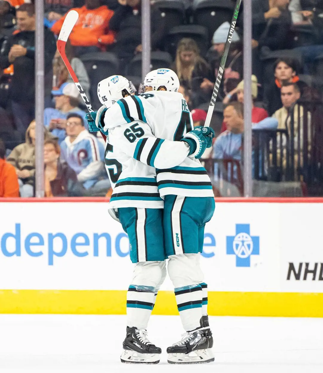 Evgeny Svechnikov and Tomas Hertl hugging each other a win over Philadelphia Flyers in October 24, 2012