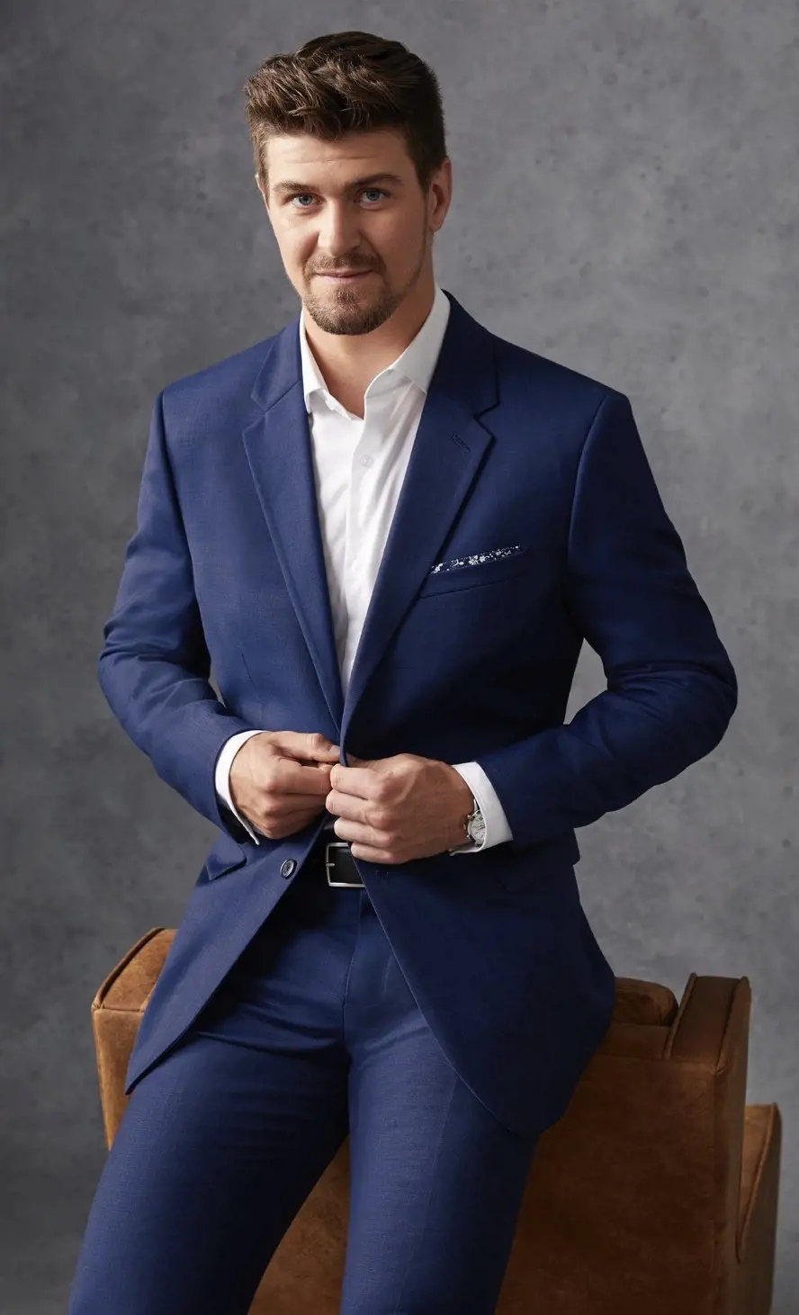 Mark Scheifele wearing a typical blue suit on October 2018
