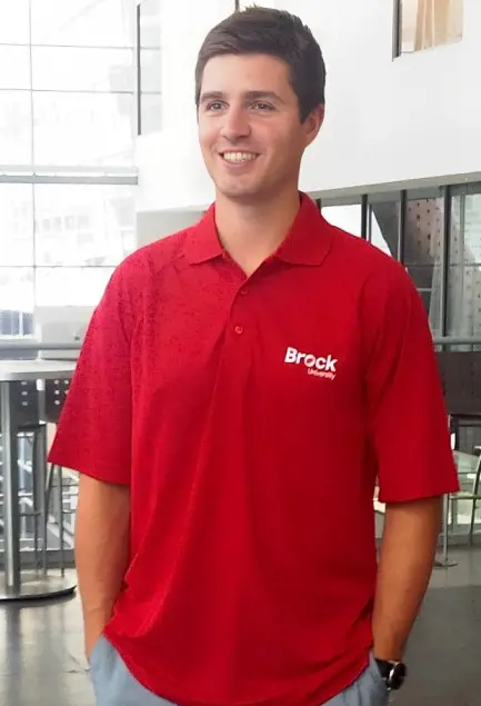 Kyle pictured while he was studying in the Brock University wearing their tshirts